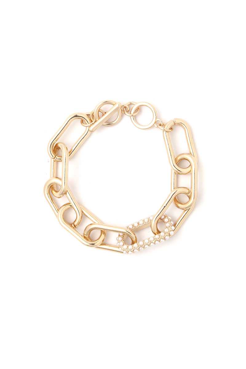 Bracelet en métal de forme ovale avec perles