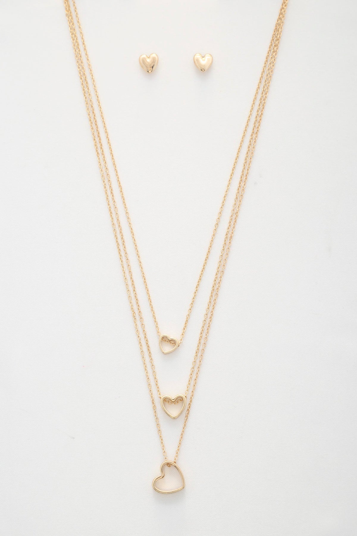 Collier superposé à breloques triple cœur