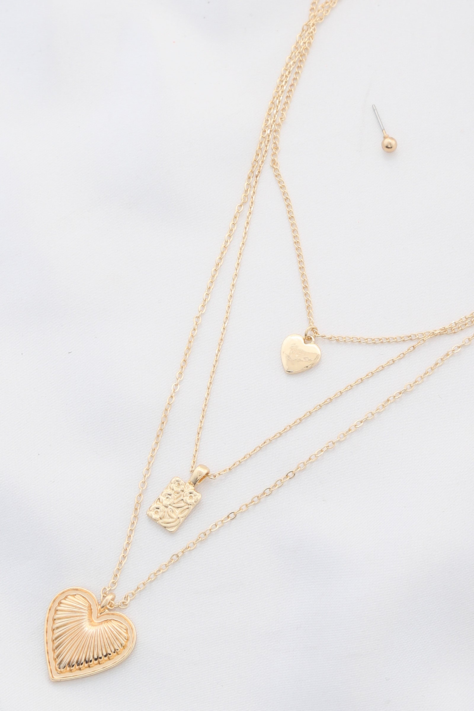 Collier superposé avec pendentif cœur