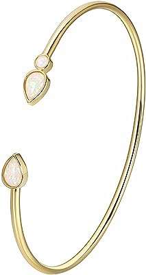 Bracelet jonc opale pour femme plaqué or 18 carats bracelet minimaliste réglable en dorée. Faites des économies sans compromis chez DIAYTAR COTE D'IVOIRE, votre destination de shopping en ligne pour des produits discount de qualité supérieure, allant des appareils électroniques à la décoration d'intérieur.