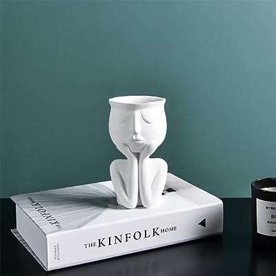 Pot de fleur vase en résine tête et visage pot de plante. Découvrez DIAYTAR COTE D'IVOIRE  et préparez-vous à vivre l'expérience d'achat en ligne ultime. Notre boutique propose une gamme complète de produits discount, de la maison aux appareils électroniques, en passant par la mode, offrant ainsi des solutions abordables pour tous vos besoins.