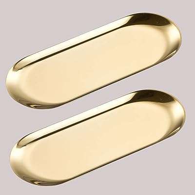 Plateau doré en acier inoxydable h blufft pour servir des bijoux. DIAYTAR COTE D'IVOIRE  - Votre destination discount pour tous vos besoins. Parcourez notre collection de produits de haute qualité, allant de la maison à l'électroménager, de l'informatique à la mode, et trouvez les meilleures offres en ligne. Profitez de nos prix imbattables et faites des économies dès maintenant!