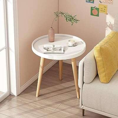 Petite table d'appoint ronde avec pieds en bois trépied blanche nilin pour salon. Faites de bonnes affaires dès aujourd'hui avec DIAYTAR COTE D'IVOIRE  ! Parcourez notre boutique en ligne généraliste où vous trouverez une large gamme de produits discount, des articles pour la maison à l'électroménager, en passant par l'informatique et la mode. Profitez de nos prix compétitifs et offrez-vous des produits de qualité à moindre coût.