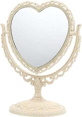 Miroir de table en forme de cœur classique brillant lux avec support. DIAYTAR COTE D'IVOIRE  - votre guichet unique pour des achats discount en ligne. Parcourez notre catalogue diversifié et trouvez des produits de qualité à des prix incroyables. Avec notre large sélection allant de la maison à l'informatique en passant par l'électroménager, vous trouverez toujours ce dont vous avez besoin chez nous.