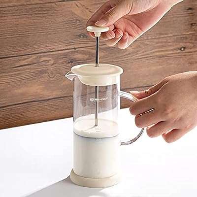 Mousseur à lait domestique manuel café bol tasse en verre. DIAYTAR COTE D'IVOIRE  est votre partenaire de confiance pour des achats en ligne à prix réduits. Explorez notre site pour trouver tout ce dont vous avez besoin, des appareils électroménagers de renom aux gadgets étonnants, et profitez de nos offres exclusives pour réaliser des économies incroyables.