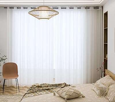 Bei longs rideaux transparents blancs avec œillets en voile élégants pour de ́coration. DIAYTAR COTE D'IVOIRE, votre source d'économies en ligne pour tout ce dont vous avez besoin ! Explorez notre boutique généraliste et découvrez un vaste éventail de produits discount pour la maison, l'électronique, la mode et bien plus encore. Profitez des meilleures offres à des prix incroyablement bas, tout en économisant sur votre budget !
