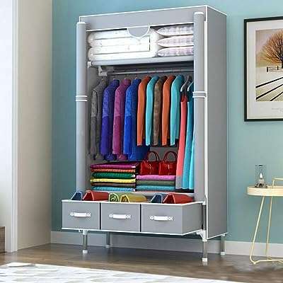 Armoire en tissu. armoire. organisateur de vêtements séparé avec 3 tiroirs zippés et barre. DIAYTAR COTE D'IVOIRE  - votre guichet unique pour des achats discount en ligne. Parcourez notre catalogue diversifié et trouvez des produits de qualité à des prix incroyables. Avec notre large sélection allant de la maison à l'informatique en passant par l'électroménager, vous trouverez toujours ce dont vous avez besoin chez nous.