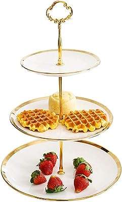 Présentoir à dessert cupcake tower design assiette ronde en céramique blanche 3 niveaux pour desserts. DIAYTAR COTE D'IVOIRE, votre destination en ligne pour des produits de maison à prix réduits. Découvrez notre vaste collection d'articles pour la cuisine, la décoration, le rangement et bien plus encore. Avec nous, équiper votre maison devient simple et économique.