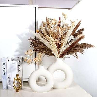 Vases en céramique blanche clonox vase rond blanc moderne moderne décor minimaliste pour mariage. DIAYTAR COTE D'IVOIRE, votre partenaire de shopping discount en ligne, regroupe une large gamme de produits à prix cassés pour tous les amateurs de bonnes affaires. Faites des économies sur vos achats de la maison à l'électroménager, de l'informatique à la mode, grâce à DIAYTAR COTE D'IVOIRE !