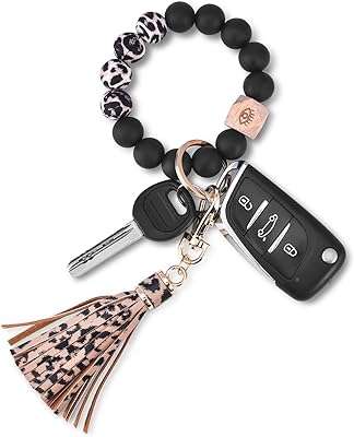 Porte clés en silicone bracelet porte clés de costume perles pour femme avec pompon. DIAYTAR COTE D'IVOIRE  - votre guichet unique en ligne pour des produits discount irrésistibles. Parcourez notre large éventail de gadgets innovants, d'équipements ménagers pratiques et de vêtements tendance à prix cassés. Ne manquez pas cette opportunité de faire de bonnes affaires et de réaliser des économies considérables.