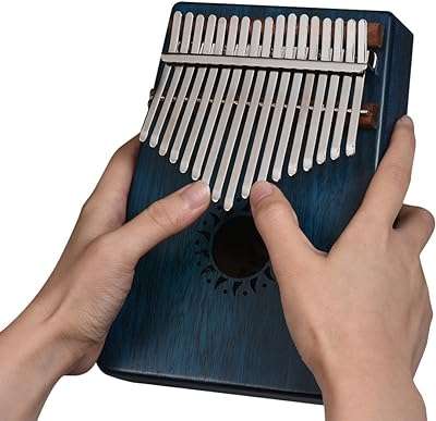 Kalimba mbira piano à pouce portable 17 touches en bois massif d'acajou pour étudiants. DIAYTAR COTE D'IVOIRE  vous propose une expérience de shopping inoubliable : explorez notre boutique en ligne pour trouver des réductions incroyables sur des produits pour la maison, l'électroménager, l'informatique et la mode. Ne sacrifiez pas la qualité pour des économies, grâce à DIAYTAR COTE D'IVOIRE !