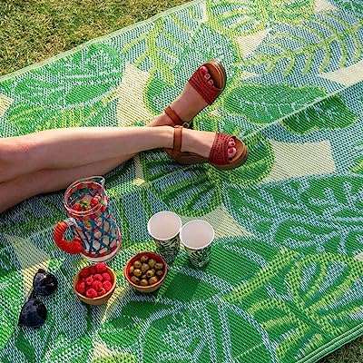 Tapis d'extérieur imperméable à feuilles de palmier tropicales vertes | en plastique. DIAYTAR COTE D'IVOIRE  - la référence en matière de shopping en ligne à prix réduit. Trouvez tout ce dont vous avez besoin pour votre maison, de l'électroménager pratique aux articles de mode tendance, en passant par les dernières innovations technologiques. Faites des économies sans compromettre la qualité avec notre selection de produits discount de confiance.