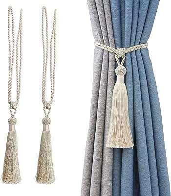 Paire d'embrasses de rideaux faites à la main avec pompons pour bureau. Bienvenue chez DIAYTAR COTE D'IVOIRE, la boutique en ligne discount pour toutes vos envies. Découvrez notre sélection exclusive de produits discount pour la maison, l'électroménager, l'informatique et la mode, et faites des économies tout en conservant la qualité. Ne manquez pas nos offres incroyables sur les derniers gadgets à la pointe de la technologie.
