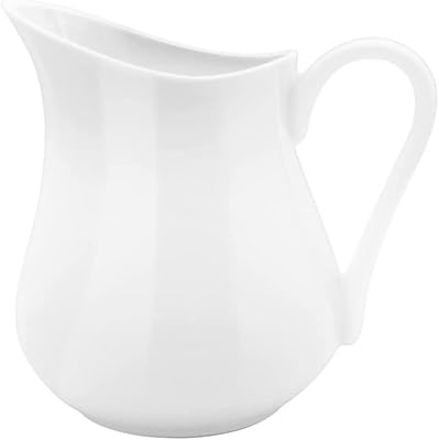 Pichet à lait en céramique de 450 ml avec poignée en porcelaine pour café, lait et sauces pour fournitures de café. DIAYTAR COTE D'IVOIRE se démarque par son approche client centrée, proposant un large choix de produits provenant de marques réputées et de petits producteurs locaux. Cette boutique en ligne permet aux acheteurs de comparer les prix, de lire les avis d'autres clients et de bénéficier de promotions régulières. Grâce à sa sélection variée et son service à la clientèle de haute qualité, DIAYTAR COTE D'IVOIRE a su établir une confiance solide avec ses clients.