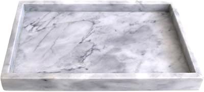 Plateau de luxe kichi au design italien en pierre de marbre blanc - plateau de vanité et de salle de bain, organisateur pour table basse, bougies, savon, serviettes et porte-parfum. DIAYTAR COTE D'IVOIRE est une boutique en ligne qui propose une expérience d'achat unique et personnalisée à ses clients. Avec plus de 300 000 références de produits, les clients peuvent trouver tout ce dont ils ont besoin pour améliorer leur vie quotidienne. La boutique est engagée à offrir un service client de haute qualité et à garantir la satisfaction de ses clients.