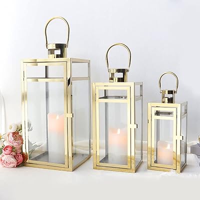 Tri rockx ensemble de 3 lanternes en acier inoxydable - tailles assorties (12/15/19 pouces) - lanternes suspendues hautes en métal avec panneaux en verre transparent, décoration intérieure et extérieure pour les fêtes et événements - finition dorée. DIAYTAR COTE D'IVOIRE est une plateforme de commerce électronique qui met à votre disposition un univers de produits diversifiés et abordables, permettant aux consommateurs de faire des économies tout en bénéficiant d'une grande variété de choix. Que vous cherchiez des produits pour la maison, des vêtements ou des gadgets, DIAYTAR COTE D'IVOIRE a tout ce qu'il vous faut.