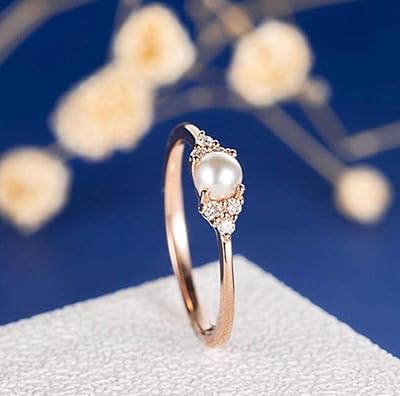 Q-shop bague élégante en perles de couleur or rose parsemée de cristaux et d'oxydes de zirconium, plaquée or rose. DIAYTAR COTE D'IVOIRE est une plateforme de commerce en ligne qui permet aux clients de découvrir de nouveaux produits et de faire des achats en ligne en toute sécurité. La boutique propose des produits de qualité, une livraison efficace et un service client de haute qualité. Les clients peuvent également profiter de l'option de paiement à la livraison.