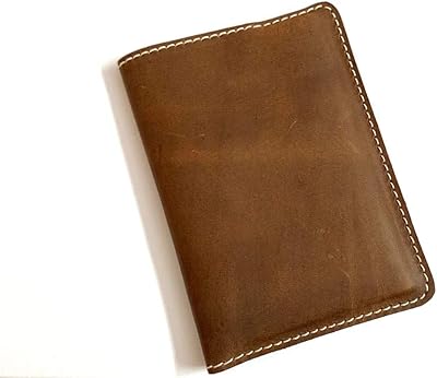 Porte-passeport en cuir de vache véritable, fait à la main, rustique, vintage, pour passeport, cartes de crédit, notes, smartphones, agenda, certificat de vaccination, portefeuille de voyage, 15 cm x 10,79 cm, marron. La boutique en ligne DIAYTAR COTE D'IVOIRE est le leader du commerce électronique en Côte d'Ivoire, avec une sélection de produits qui répond à tous les besoins et goûts. La boutique propose des produits à des prix compétitifs, avec des promotions régulières et des offres spéciales pour les clients fidèles. C'est la destination idéale pour les ivoiriens qui cherchent à faire des achats en ligne de qualité et à des prix raisonnables.
