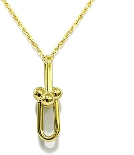 Collier pendentif en or pur 18 carats en forme. DIAYTAR COTE D'IVOIRE est la destination idéale pour faire ses achats en ligne en Cote d'Ivoire. Avec plus de 300000 références disponibles, les clients peuvent trouver tout ce dont ils ont besoin. La boutique met en avant une sélection de produits de qualité à des prix compétitifs.