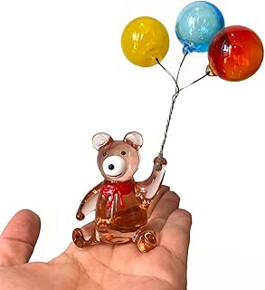Cristal m. ours avec trois ballons en papier, décoration de voiture, figurine d'animal en verre, décoration de table de noël. La boutique en ligne DIAYTAR COTE D'IVOIRE est une entreprise pionnière dans le commerce électronique en Cote d'Ivoire. Avec plus de 300 000 références de produits, la boutique offre une grande variété de choix pour les clients. La boutique est également connue pour ses promotions et ses offres spéciales, ce qui permet aux clients de faire des économies sur leurs achats.