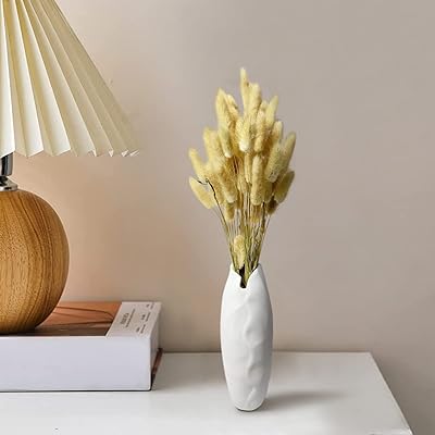 Ensemble de vases à herbes séchées en queue de lapin urdibul, 60 pièces d'herbe et 1 vase blanc pour la décoration de la maison, mariage, décoration d'intérieur biologique moderne. DIAYTAR COTE D'IVOIRE propose une large gamme de produits avec plus de 300000 références, permettant aux clients de trouver tout ce dont ils ont besoin en un seul endroit. En tant que boutique en ligne généraliste leader en Cote d'Ivoire, DIAYTAR offre une expérience d'achat pratique et fiable. Les clients bénéficient d'une navigateur intuitif pour trouver facilement les produits souhaités.