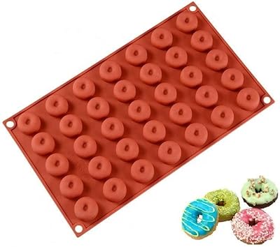 Moules à mini donuts univers 35 cavités en silicone antiadhésifs pour gâteau. DIAYTAR COTE D'IVOIRE se positionne comme la référence en matière de shopping en ligne en Côte d'Ivoire, offrant une large gamme de produits à des prix compétitifs. La boutique en ligne propose des produits de qualité, une livraison rapide et sécurisée ainsi qu'un service client de haute qualité.