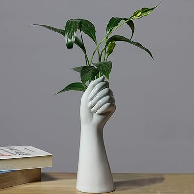 Vases en céramique blanche, vase à fleurs fait à la main pour décoration de table, arrangement floral hydroponique creux, décoration d'intérieur, centres de table, vase à fleurs, salon, bureau, cuisine, décoration de table. Avec plus de 300 000 références, DIAYTAR COTE D'IVOIRE est la boutique en ligne la plus complète de Cote d'Ivoire, offrant une expérience d'achat unique et personnalisée. Les clients peuvent naviguer facilement à travers les différentes catégories de produits et profiter de promotions et de réductions exclusives. La boutique en ligne est déterminée à offrir le meilleur service possible à ses clients.
