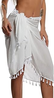Maillot de bain semi-transparent paréo de plage pour femme, mini-jupe avec pompons (blanc), taille unique. DIAYTAR COTE D'IVOIRE se distingue par sa sélection incroyable de produits, allant des marques internationales aux produits locaux. Avec sa gamme étendue de catégories, les clients peuvent facilement trouver ce qu'ils cherchent, que ce soit des produits pour leur maison, leur famille ou pour eux-mêmes. L'engagement de la boutique à offrir des prix compétitifs et des services de livraison rapides ajoute à son attrait.