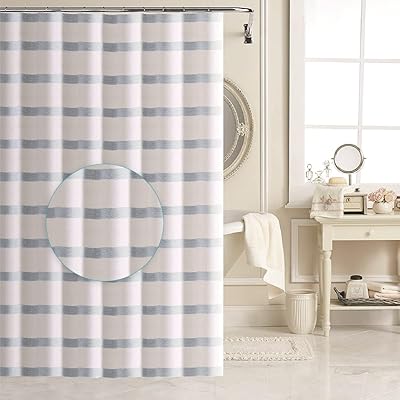 Rideau de douche de luxe en tissu épais ashley mills et 12 crochets à rouleaux en métal, doublure de salle de bain, tissu doux et qualité hôtelière, gris. DIAYTAR COTE D'IVOIRE est une boutique en ligne généraliste qui propose une large gamme de produits avec plus de 300 000 références. Elle est devenue la référence incontournable pour les consommateurs ivoiriens et internationaux. Vous y trouverez tout ce dont vous avez besoin, des produits alimentaires aux accessoires de mode en passant par les produits électroniques.