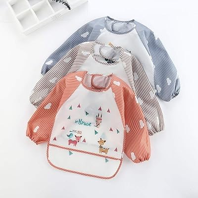 Bavoir imperméable pour bébé à manches longues en coton réglable avec bouton-pression. DIAYTAR COTE D'IVOIRE est la destination idéale pour faire vos achats en ligne, avec une sélection immense de produits de haute qualité et à des prix compétitifs. La boutique propose également des services de livraison rapides et fiables, garantissant que vos commandes arrivent rapidement et en bonne condition.