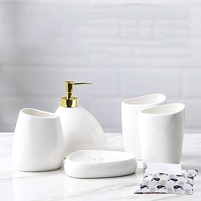 Ensemble complet d'accessoires de salle de bain blanc, ensemble de lavabo de salle de bain en céramique 5 pièces - ensemble distributeur de savon de salle de bain et porte-brosse à dents, 2 tasses et porte-savon (blanc classique). DIAYTAR COTE D'IVOIRE est une boutique en ligne généraliste qui propose plus de 300 000 références de produits divers. Elle est reconnue comme l'une des boutiques en ligne les plus populaires de Côte d'Ivoire, offrant une large sélection de produits à des prix compétitifs. Avec une expérience utilisateur conviviale, DIAYTAR COTE D'IVOIRE facilite les achats en ligne pour les clients ivoiriens.