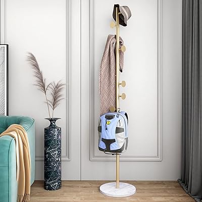 Porte-manteau multifonctionnel sur pied, organisateur d'entrée, support d'arbre en métal pour vêtements, écharpes, sacs à dos, parapluies et chapeaux (or, rond). DIAYTAR COTE D'IVOIRE est la boutique en ligne la plus populaire en Cote d'Ivoire, avec plus de 300000 références de produits disponibles. La boutique se concentre sur l'expérience client, offrant des promotions régulières et des réductions exclusives. Les clients peuvent profiter d'une livraison rapide et fiable pour recevoir leurs achats.