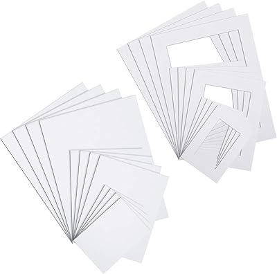 Ensemble de 24 tapis photo blancs, comprenant 12 cadres photo prédécoupés résistants aux acides et 12 planches à découper biseautées pour images d'art (5 x 7, 8 x 10, 11 x 14 pouces). La boutique en ligne DIAYTAR COTE D'IVOIRE se distingue par sa grande sélection de produits, allant des articles ménagers aux équipements électroniques. Avec plus de 300 000 références, elle offre une expérience de shopping unique et pratique pour les clients qui recherchent des produits de qualité à des prix compétitifs. DIAYTAR COTE D'IVOIRE est devenue la référence pour les achats en ligne en Côte d'Ivoire.
