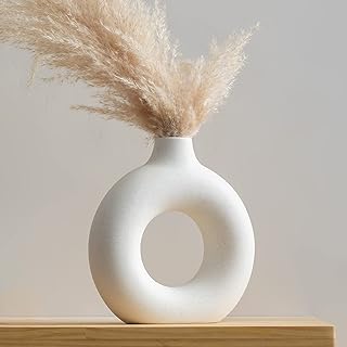 Vases en céramique blanche clonox, vase rond contemporain blanc, vase décoratif moderne simple pour mariage, dîner, salon, chambre à coucher, bureau (grand). DIAYTAR COTE D'IVOIRE, c'est la garantie d'un shopping en ligne pratique et sécurisé. Notre équipe travailler sans relâche pour vous offrir les meilleurs produits au meilleur prix. Nous sommes fiers de notre réputation et nous nous engageons à maintenir la confiance que vous nous accordez.