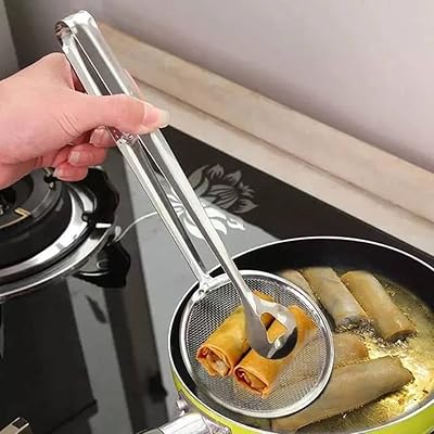 Passoire alimentaire 2 en 1 avec spatule en acier inoxydable, passoire à huile pour aliments frits, outils de cuisine portables. La boutique en ligne Diaytar Côte d'Ivoire est le leader du marché ivoirien en termes de vente en ligne. Elle propose une sélection immense de produits de toutes les catégories, ce qui permet aux clients de trouver facilement ce qu'ils cherchent. La boutique en ligne est sécurisée et fiable, ce qui garantit aux clients une expérience d'achat en toute confiance.