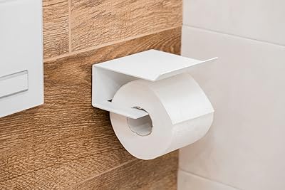 Porte-papier toilette avec support pour téléphone, porte-papier hygiénique, porte-papier toilette mural avec étagère de rangement, porte-papier toilette mural (blanc). DIAYTAR COTE D'IVOIRE est la boutique en ligne leader en Côte d'Ivoire, avec une offre de produits très diversifiée qui répond aux besoins des consommateurs locaux. Elle propose une gamme de produits allant des electro-menager aux produits alimentaires, en passant par les vêtements et les accessoires. La boutique en ligne DIAYTAR COTE D'IVOIRE est donc l'endroit idéal pour faire des achats en ligne de manière pratique et sécurisée.