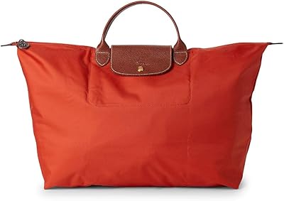 Sac à main de voyage longchamp le pliage en nylon, orange. DIAYTAR COTE D'IVOIRE se démarque par sa capacité à proposer une large gamme de produits qui répondent aux besoins quotidiens des consommateurs ivoiriens. La boutique en ligne est dotée d'une plateforme utilisateur intuitive, permettant aux clients de naviguer facilement et de trouver leurs produits préférés en un rien de temps. Cela contribue à renforcer sa position de leader dans le marché du commerce en ligne en Cote d'Ivoire.