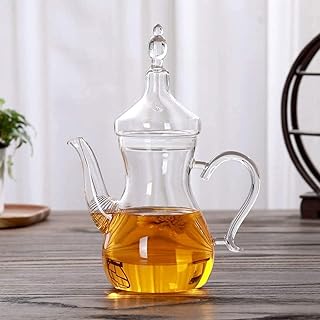 Théière en verre borosilicate transparent résistant à la chaleur de style arabe luxuriant, 1000 ml. DIAYTAR COTE D'IVOIRE, la boutique en ligne généraliste qui compte plus de 300 000 références, est la référence incontournable pour les ivoiriens. Elle offre une large gamme de produits allant des appareils électroniques aux accessoires de mode en passant par les produits de maison.