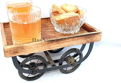 Plateau de service de table à manger en bois art & craft india / chariot thela / plateau de service de nourriture et de collations. DIAYTAR COTE D'IVOIRE est une boutique en ligne généraliste qui propose plus de 300 000 références de produits, faisant d'elle l'un des leaders du e-commerce en Côte d'Ivoire. La boutique offre une large gamme de produits allant des électroniques aux vêtements, en passant par les accessoires et les produits de maison. Avec une telle variété, les clients peuvent trouver tout ce dont ils ont besoin en un seul endroit.