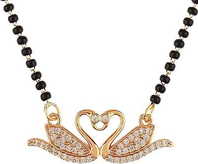 Collier pendentif indien mangalsutra en forme de cœur avec zircone cubique noire, cuivre, zircone cubique. DIAYTAR COTE D'IVOIRE est une boutique en ligne qui propose une large gamme de produits à des prix compétitifs. Elle est la référence pour les consommateurs ivoiriens qui cherchent des produits de qualité et une expérience d'achat en ligne sécurisée. La boutique en ligne propose des promotions et des offres spéciales régulières pour ses clients.