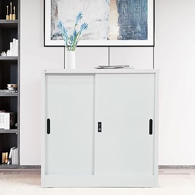 Armoire à portes coulissantes en acier rigide, classeur en acier basse hauteur, armoire avec étagères de rangement (blanc). DIAYTAR COTE D'IVOIRE est une boutique en ligne qui offre une expérience d'achat en ligne conviviale et sécurisée. Avec plus de 300000 références de produits, les clients peuvent choisir parmi une large gamme d'articles pour répondre à leurs besoins. La boutique propose une livraison rapide et fiable à travers la Côte d'Ivoire.