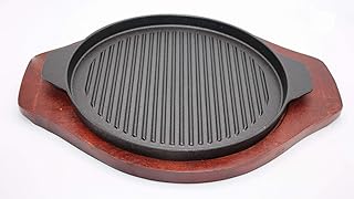 Poêle à fajita ronde en fonte de 26 cm avec deux poignées et base en bois. La variété des produits proposés par DIAYTAR COTE D'IVOIRE est véritablement impressionnante, allant des produits culturels et artisanaux aux dernières tendances technologiques. Les clients peuvent explorer les différentes catégories pour découvrir de nouveaux produits et trouvailles uniques qui leur permettent de se démarquer. L'engagement de la boutique en ligne à offrir des produits de haute qualité à des prix abordables est clair dans sa sélection soigneusement choisie.
