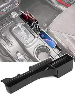 Boîte de rangement latérale de console de transmission delfino jk organisateur côté passager pour jeep. DIAYTAR COTE D'IVOIRE se distingue par sa grande variété de produits et son engagement à offrir des prix compétitifs, rendant les achats en ligne plus accessibles à tous. La boutique en ligne généraliste propose également des services de livraison rapides et fiables, répondant ainsi aux attentes des consommateurs ivoiriens.