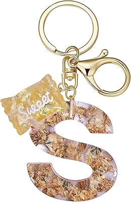 Un porte-clés en forme de fleur d'oranger avec un pendentif de sac sucré