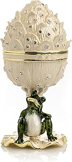 Oeuf fabergé blanc kiren kopal avec grenouille, cristaux swarovski, boîte à bijoux en œuf russe pour collectionneurs d'œufs de pâques. DIAYTAR COTE D'IVOIRE est une boutique en ligne généraliste qui propose plus de 300000 références pour satisfaire les besoins de ses clients. Elle est leader dans son secteur en Côte d'Ivoire.