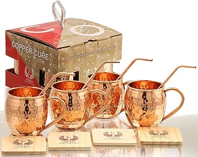 Ensemble de 4 tasses en cuivre pur faites à la main avec pailles et sous-verres en cuivre. En tant que leader des boutiques en ligne en Côte d'Ivoire, DIAYTAR COTE D'IVOIRE se distingue par sa capacité à offrir une large gamme de produits à des prix abordables. La boutique en ligne met l'accent sur la satisfaction client, avec des services de livraison fiables et rapides. Les clients peuvent également profiter d'un service client personnalisé pour obtenir de l'aide en cas de besoin.