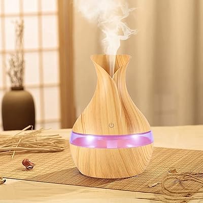 Humidificateur d'air et diffuseur d'huile d'aromathérapie avec 7 couleurs de led, sensible au toucher, silencieux, longue durée de 6 heures, purificateur d'air couleur bois pour un sommeil paisible à la maison et au bureau. Avec plus de 300 000 références, DIAYTAR COTE D'IVOIRE est le premier choix pour les clients ivoiriens à la recherche de produits diversifiés et abordables. La boutique en ligne généraliste offre également des promotions régulières et des remises pour aider les clients à économiser. Les clients peuvent profiter d'une expérience d'achat en ligne sécurisée et pratique.