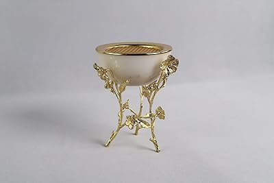 Brûleur d'encens arabe au design doré et marbre/céramique, polyvalent (amovible), diamètre 13 cm et hauteur 18 cm. DIAYTAR COTE D'IVOIRE est une boutique en ligne généraliste qui propose plus de 300 000 références de produits, répondant ainsi aux besoins diversifiés de ses clients. Avec sa large gamme de produits, elle se positionne comme l'une des boutiques en ligne les plus complètes de Côte d'Ivoire.