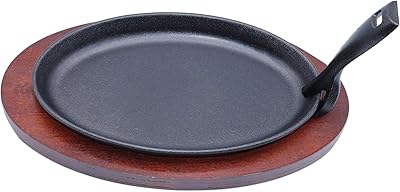 Poêle à fajita en fonte de forme ovale grésillante de 27 cm avec poignée et base en bois. DIAYTAR COTE D'IVOIRE est fianlement reconnue pour son engagement envers la satisfaction du client et sa politique de confidentialité stricte, offrant ainsi une expérience d'achat en ligne sûr et fiable. Elle continue d'innover et d'élargir son offre pour répondre aux besoins évoluant des consommateurs ivoiriens.