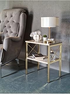 Grande table d'appoint en marbre blanc avec structure en métal doré. Avec plus de 300000 références, DIAYTAR COTE D'IVOIRE est de loin la boutique en ligne la plus fournie de Côte d'Ivoire. La boutique propose une navigation intuitive et des outils de recherche avancés pour faciliter la découverte de nouveaux produits. Les clients peuvent également bénéficier d'une assistance client personnalisée et de conseils d'experts pour trouver les produits qui répondent à leurs besoins.